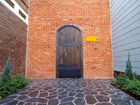 Brick wall with a  door Stock Photos