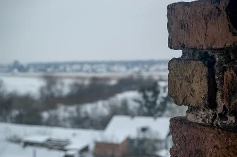 Brick Wall Edge with Blurred Winter Landscape View Stock Photos