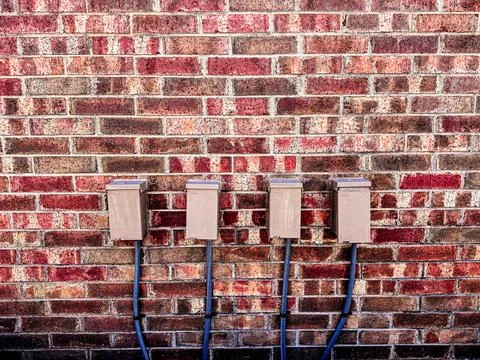 Brick wall electrical box Foto stock