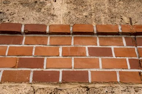 Brick wall embedded in a house wall Foto stock