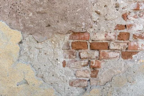 Brick wall with falling apart texture background rough grunge space for text Stock Photos