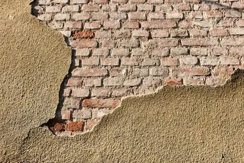 Brick wall with falling mortar cover Stock Photos