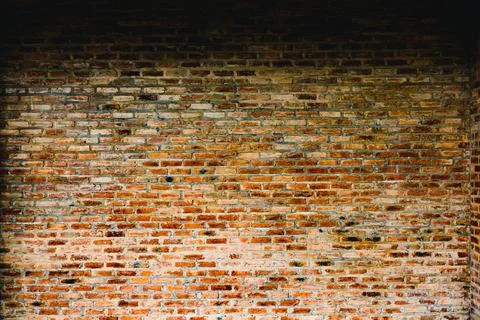 A brick wall with a few bricks missing Stock Photos