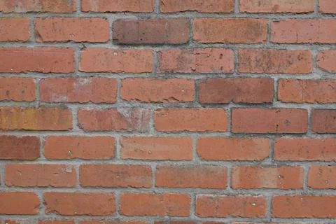 A brick wall with a few bricks missing Stock Photos