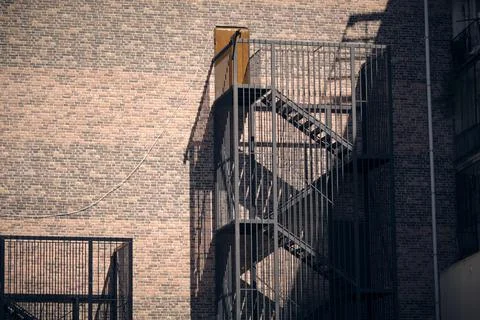Brick wall with fire escape Stockfoto's
