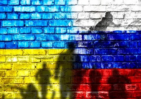 A brick wall with a flag on it Stock-Fotos