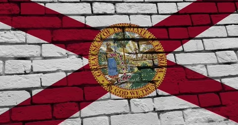 A brick wall with the florida state flag of the United States of America Vídeo Stock 337428351