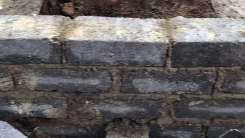 Brick wall foundation, being built. Stock Footage 252343951
