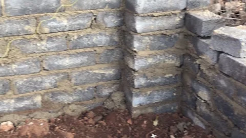 Brick wall foundation, being built. Video stock 252344026