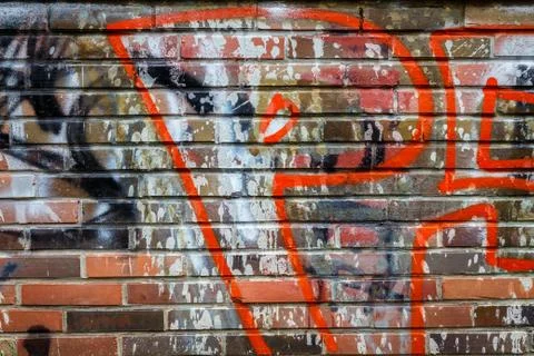 Brick wall with graffiti Stock Photos