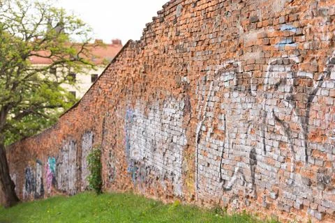 Brick wall with graffiti Stock Photos