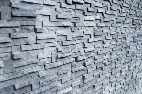 Brick wall in gray background Stock Photos