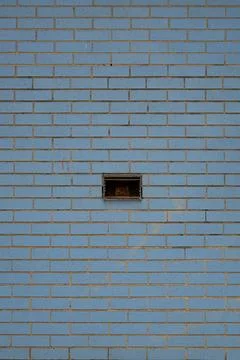A brick wall with a hole in it Stock Photos