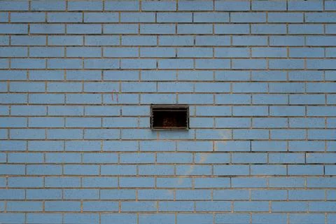 A brick wall with a hole in it Stock Photos