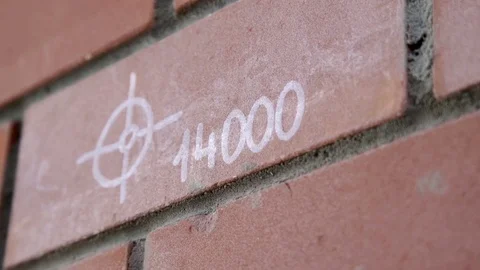 Brick wall with an inscription Stock Footage 80487082