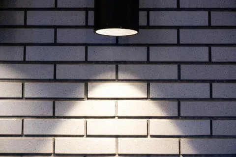 Brick wall with a lamp background Stock Photos