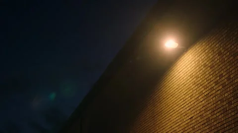 Brick wall with lamp on it at night cinamtic timelapse - two shot bundle 스톡 동영상 246392481