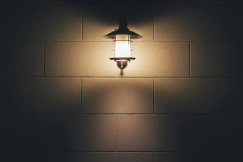 Brick wall lantern Stock Photos