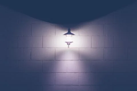 Brick wall lantern Stock Photos