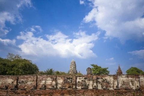Brick wall with a large building in the background Stock Photos