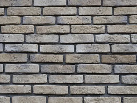 Brick wall with large gaps for cement. Unusual brick laying. 스톡 사진
