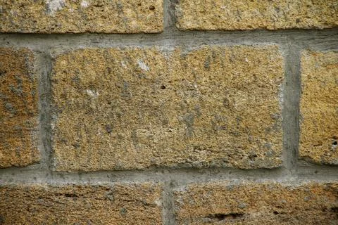 Brick wall from limestone close-up Stock Photos