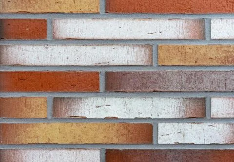 Brick wall from of long bricks. Background and texture of brickwork. Stock Photos