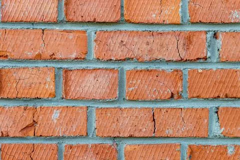 A brick wall in the macro style in orange and gray tones Stock Photos