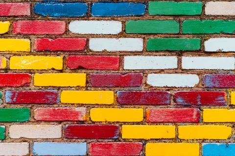 Brick wall made of colored bricks Stock Photos