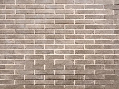 Brick wall made of gray bricks. Background and texture. Stock Photos