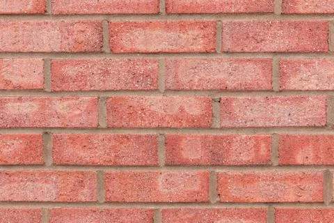 Brick wall made from light red bricks for use as a background. Stock Photos