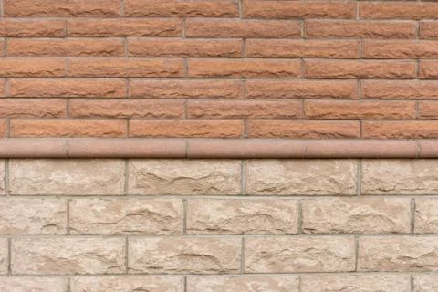 Brick wall made of two types of bricks. Stock Photos