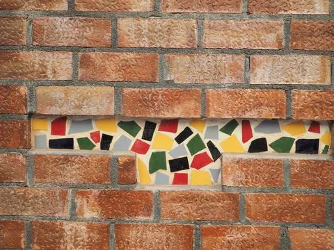 Brick wall with mosaic insert 写真素材