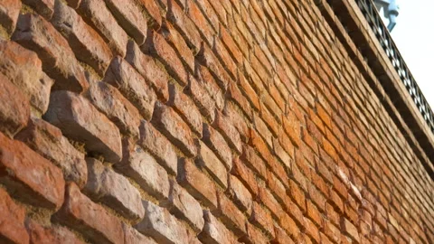 Brick wall moving closer revealing texture Stockbeeldmateriaal 334432568