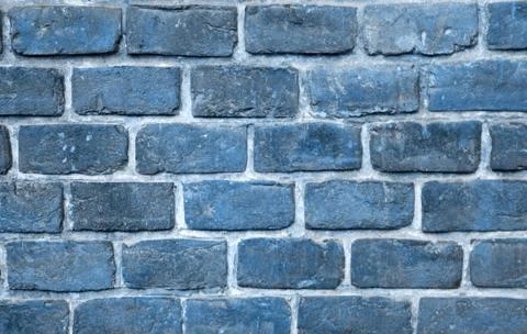 Brick wall. Natural pattern stone blue background. Trendy 2020 year color. Stock Photos