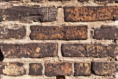 Brick wall of an old house Stock Photos