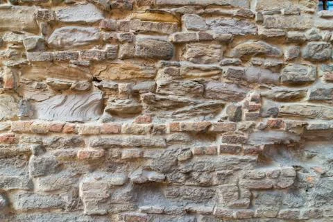 Brick wall in old stone Stock Photos