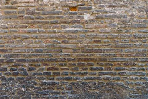 Brick wall in old stone Stock Photos