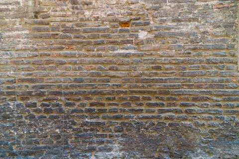 Brick wall in old stone Stock Photos
