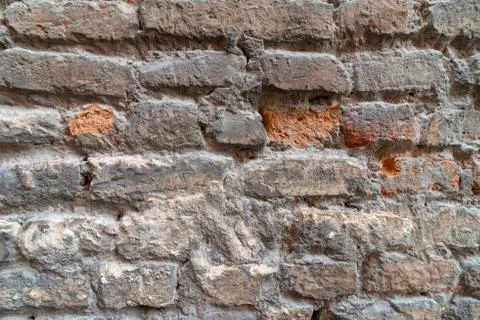 Brick wall in old stone Stock Photos