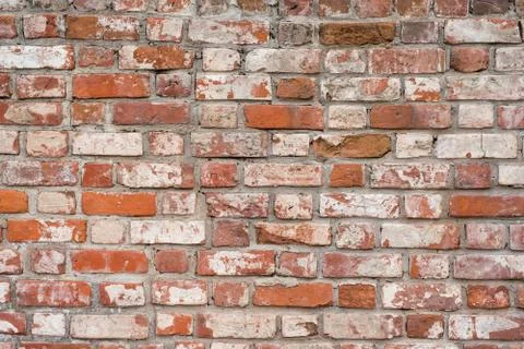 Brick wall, old texture of red stone blocks. Background. Fotos Stock