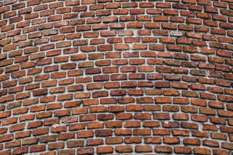 Brick wall of old tower or castle Stock Photos
