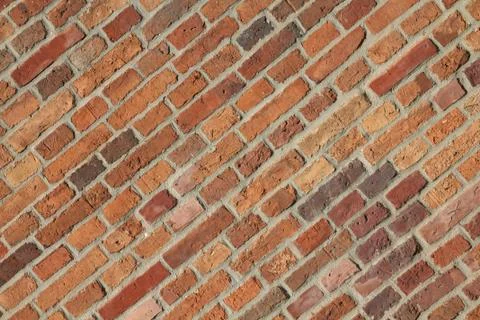 Brick wall - orange background texture. Patterned abstract. Stock Photos