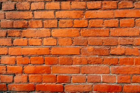 Brick wall orange loft texture background Foto stock