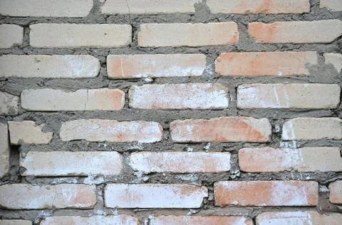 Brick wall with paint spots Stock Photos