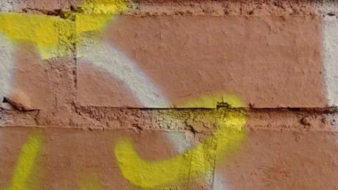 Brick wall painted in different bright colors Stock Photos