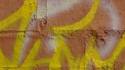 Brick wall painted in different bright colors Stock Photos