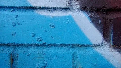 Brick wall painted in different bright colors Foto stock