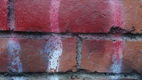 Brick wall painted in different bright colors Stock-Fotos