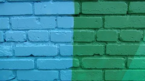 Brick wall painted in different bright colors Stock Photos